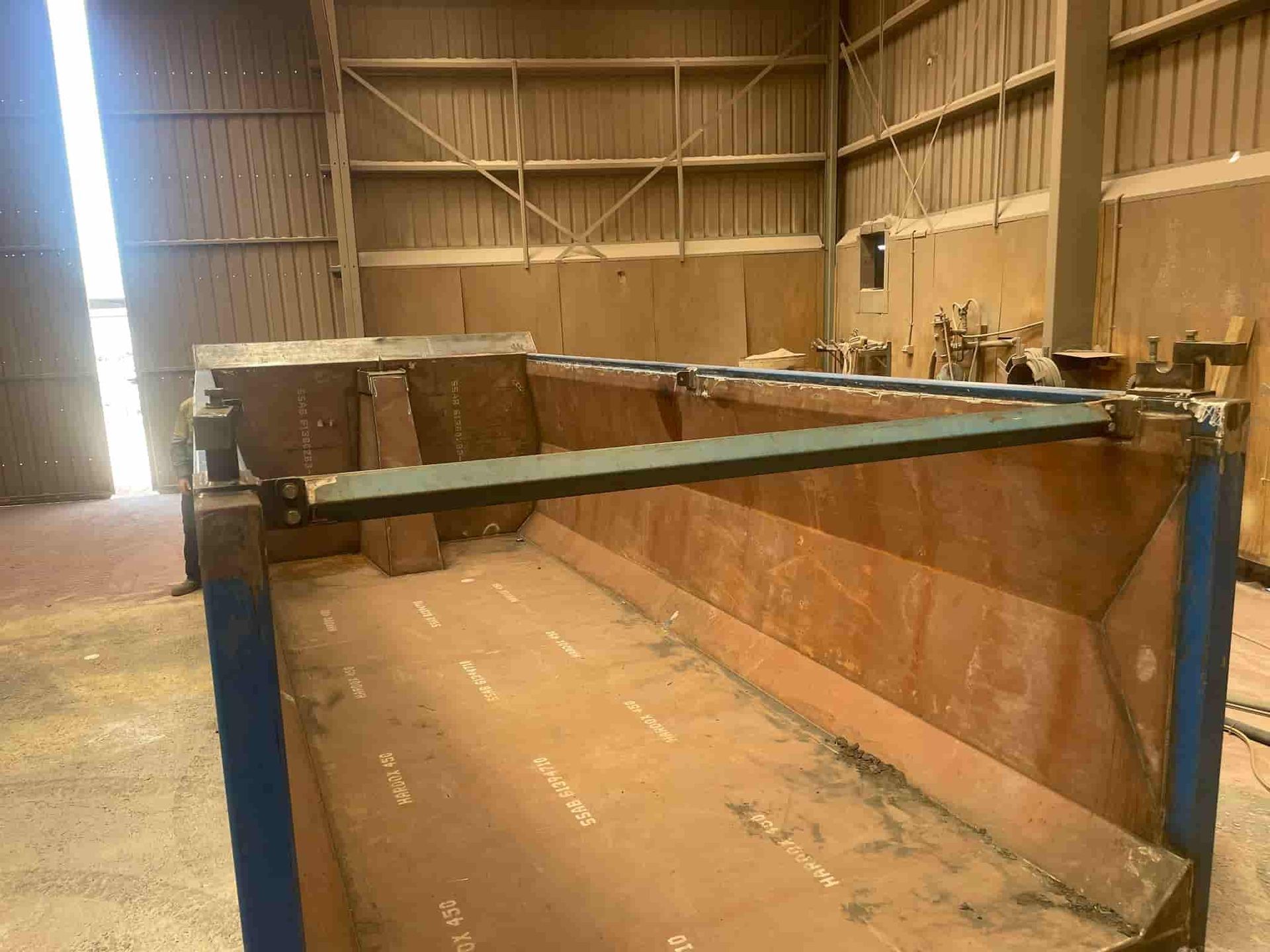A Large Metal Container is Sitting in a Warehouse — North Queensland Hard Facing (NQHF) In Collinsville, QLD