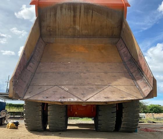A Large Dump Truck is Parked in a Dirt Lot — North Queensland Hard Facing (NQHF) In Fredericksfield, QLD
