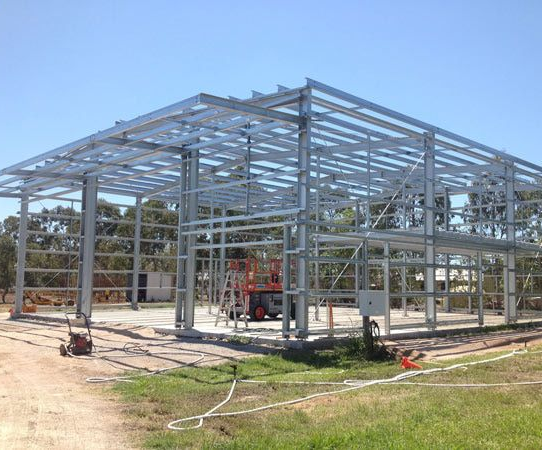 A Large Metal Structure is Being Built in a Field — North Queensland Hard Facing (NQHF) In Fredericksfield, QLD
