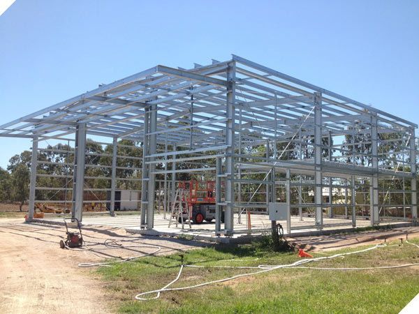 A Large Metal Structure is Being Built in a Field — North Queensland Hard Facing (NQHF) In Fredericksfield, QLD