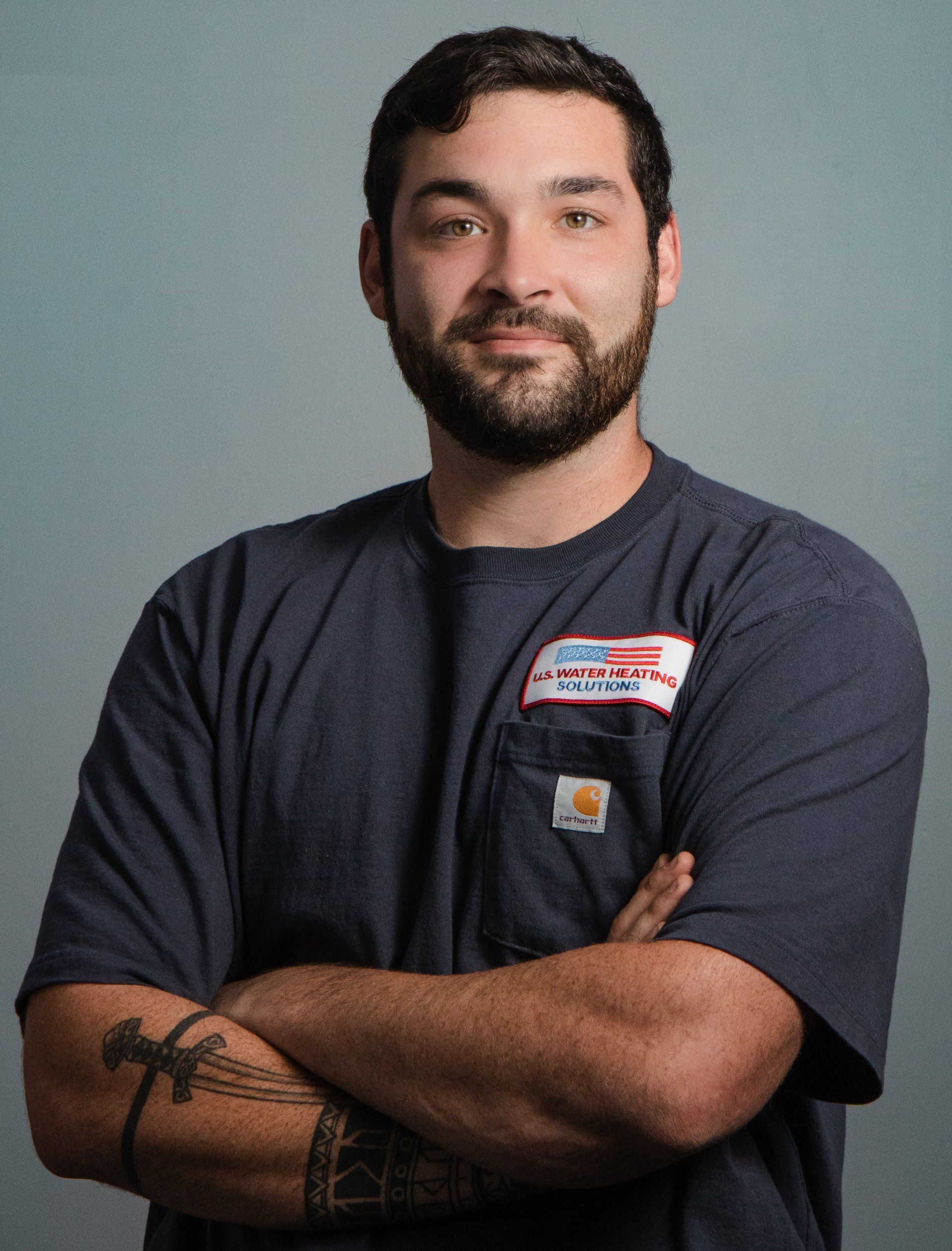 Water heater service technician poses for headshot