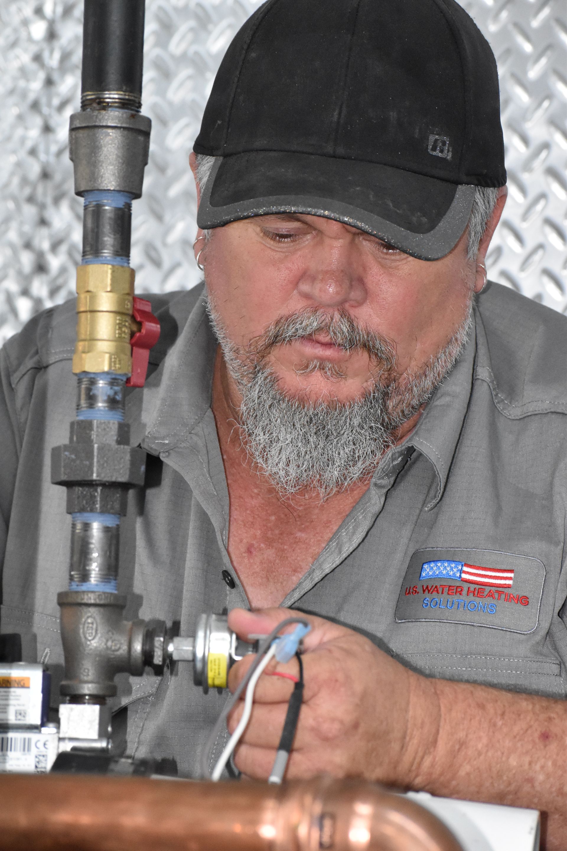 Technician repairing commercial water heater
