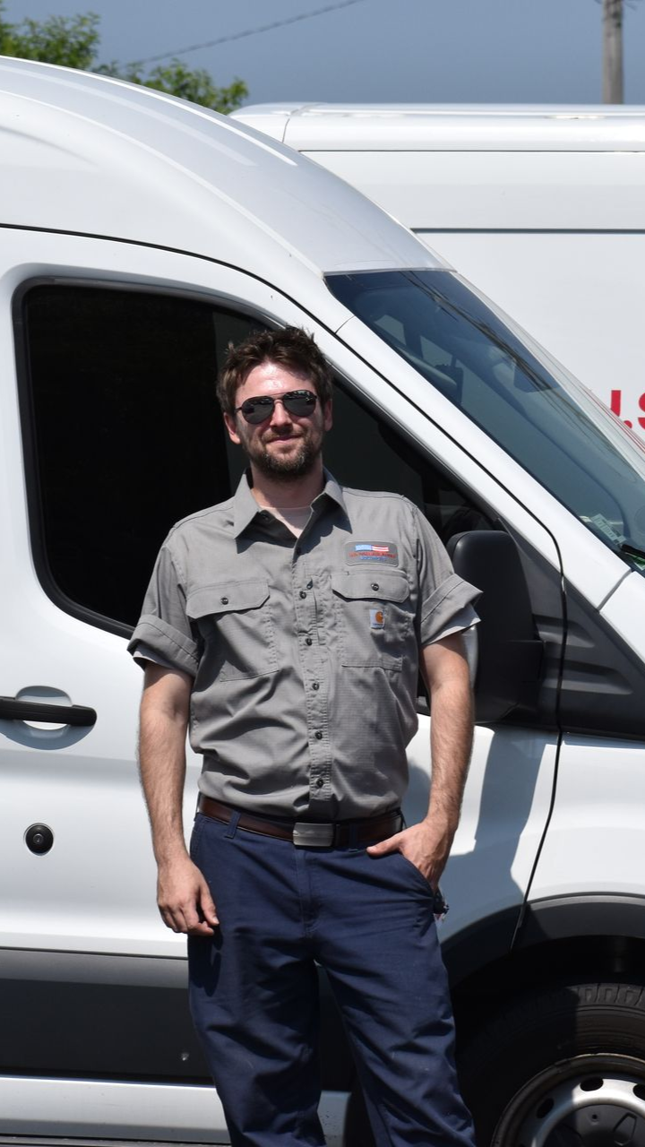 Water heater technician preparing to perform water heater warranty replacement