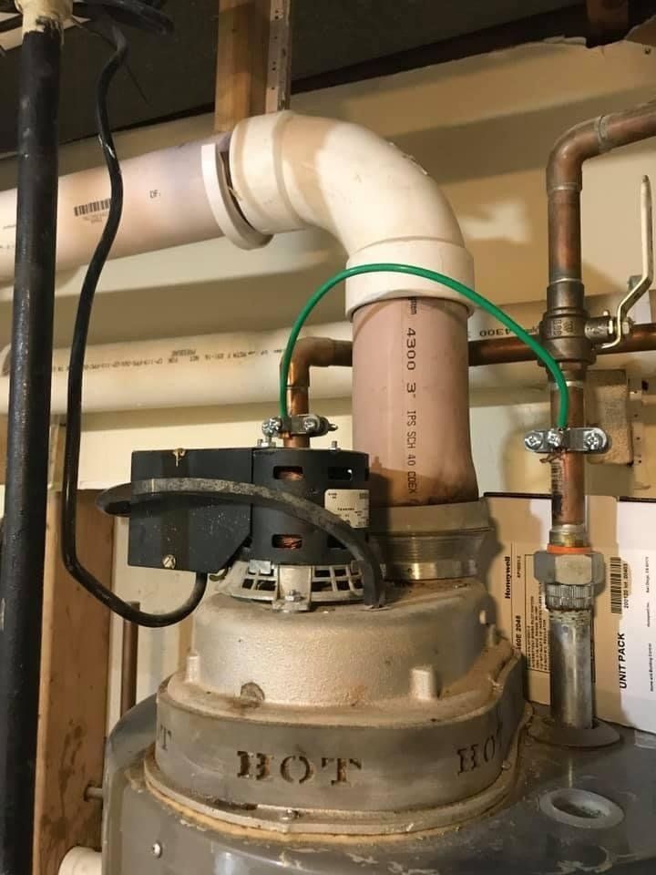 Pink PVC caused by incorrect water heater venting