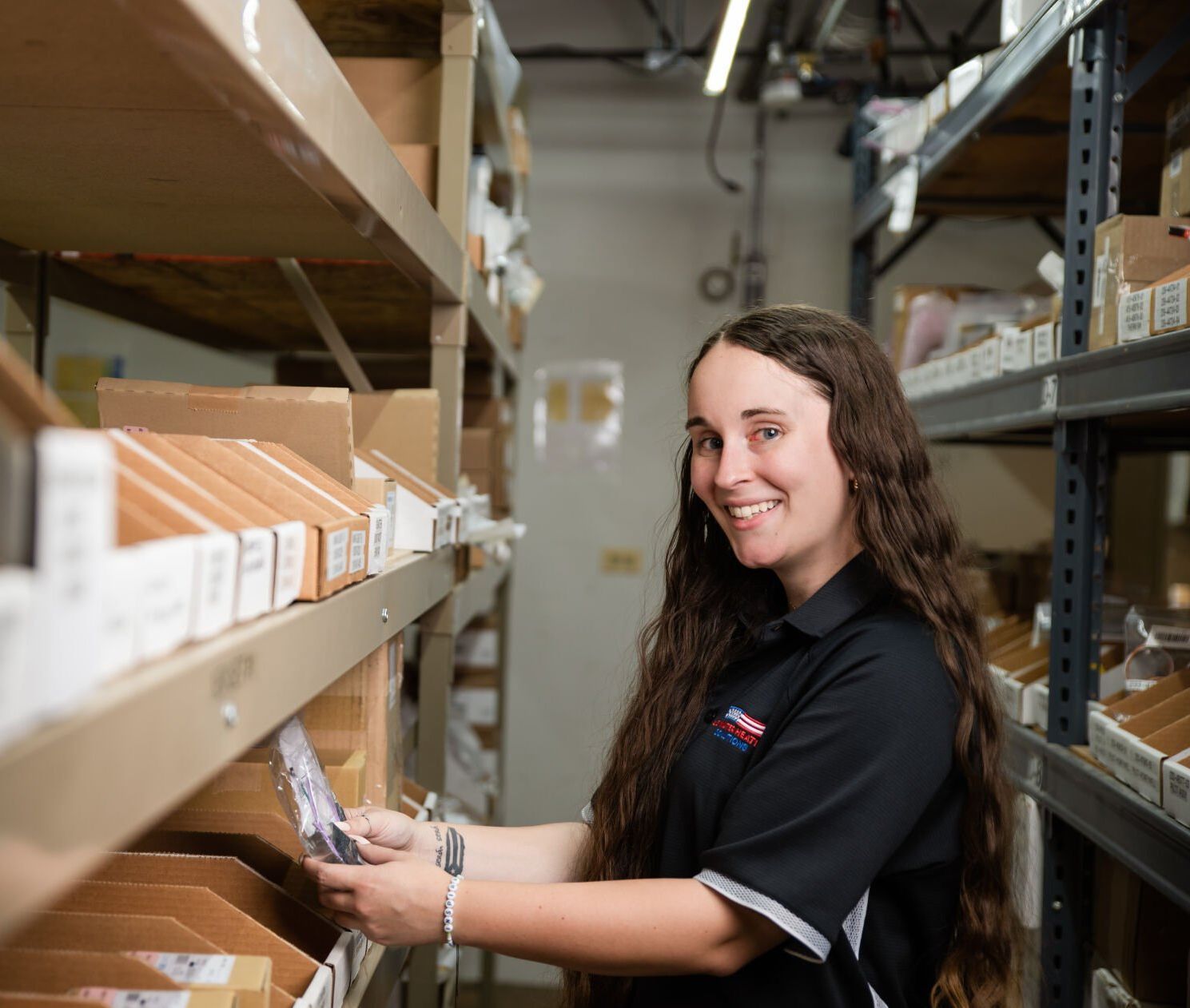 Team member picking commercial water heater parts