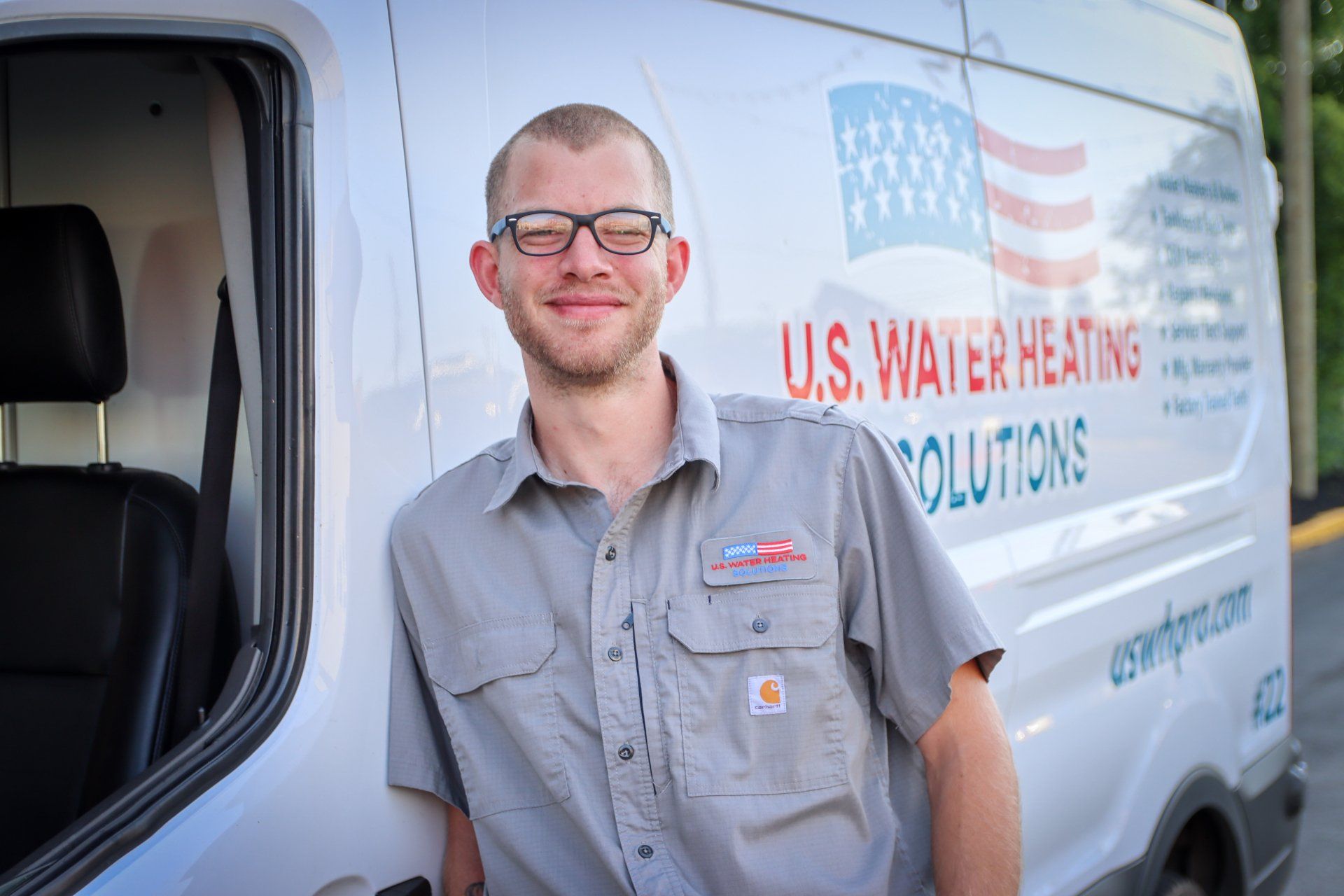 Water Heater Repair Technician Stephen H. leaning against his uswhpro truck