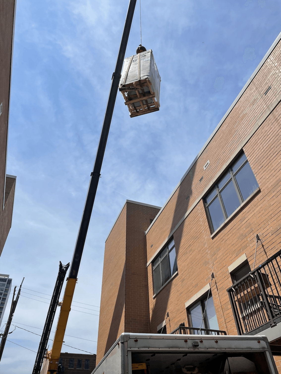 Lifting a water heater by crane