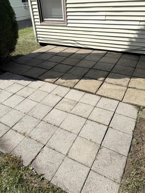 a truck is parked on the side of the road next to a fallen tree .
