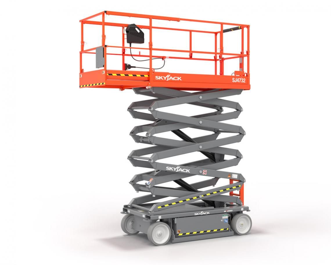 Un elevador de tijera está colocado encima de una superficie blanca.