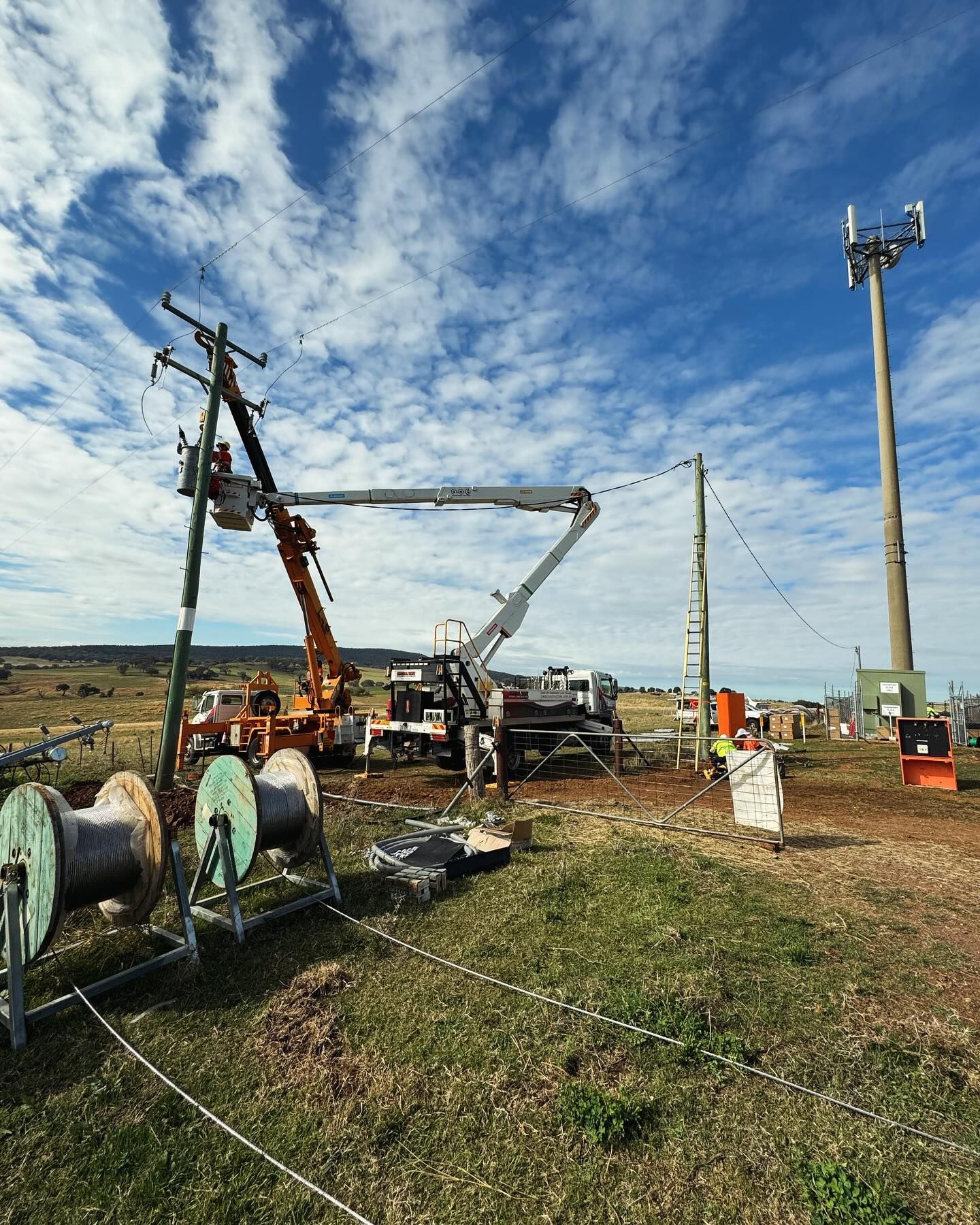 Construction Site With Workers on Power Lines, Using Machinery — Central West Power Construction in Orange, NSW