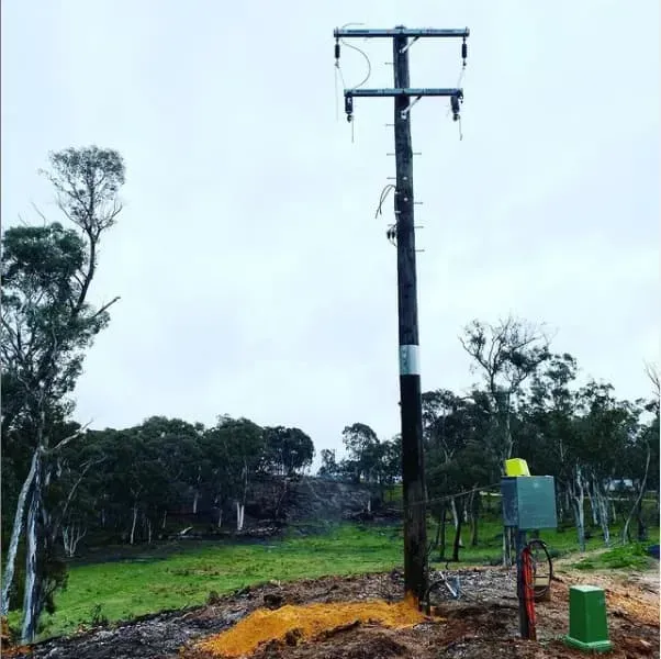 Utility Pole in a Field, With Electrical Equipment — Central West Power Construction in Orange, NSW