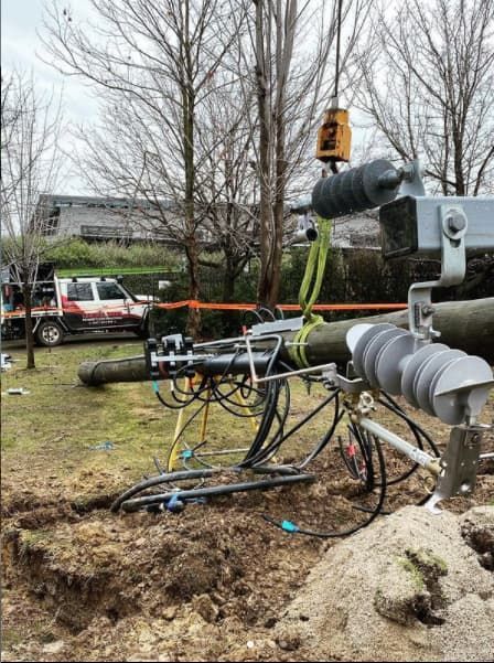 Power Pole Repair: Cables and Equipment on the Ground, a Truck Nearby — Central West Power Construction in Orange, NSW