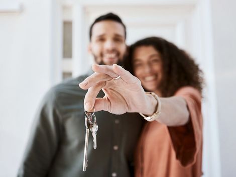 Couple with keys to new home