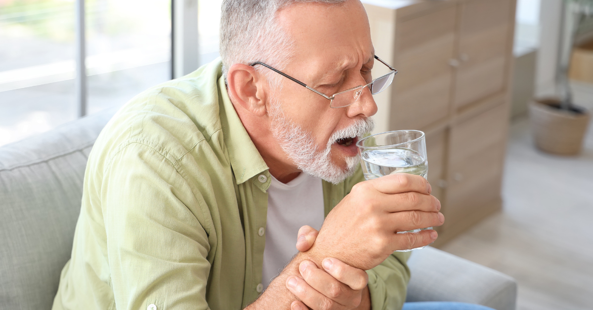 A senior citizen drinking water