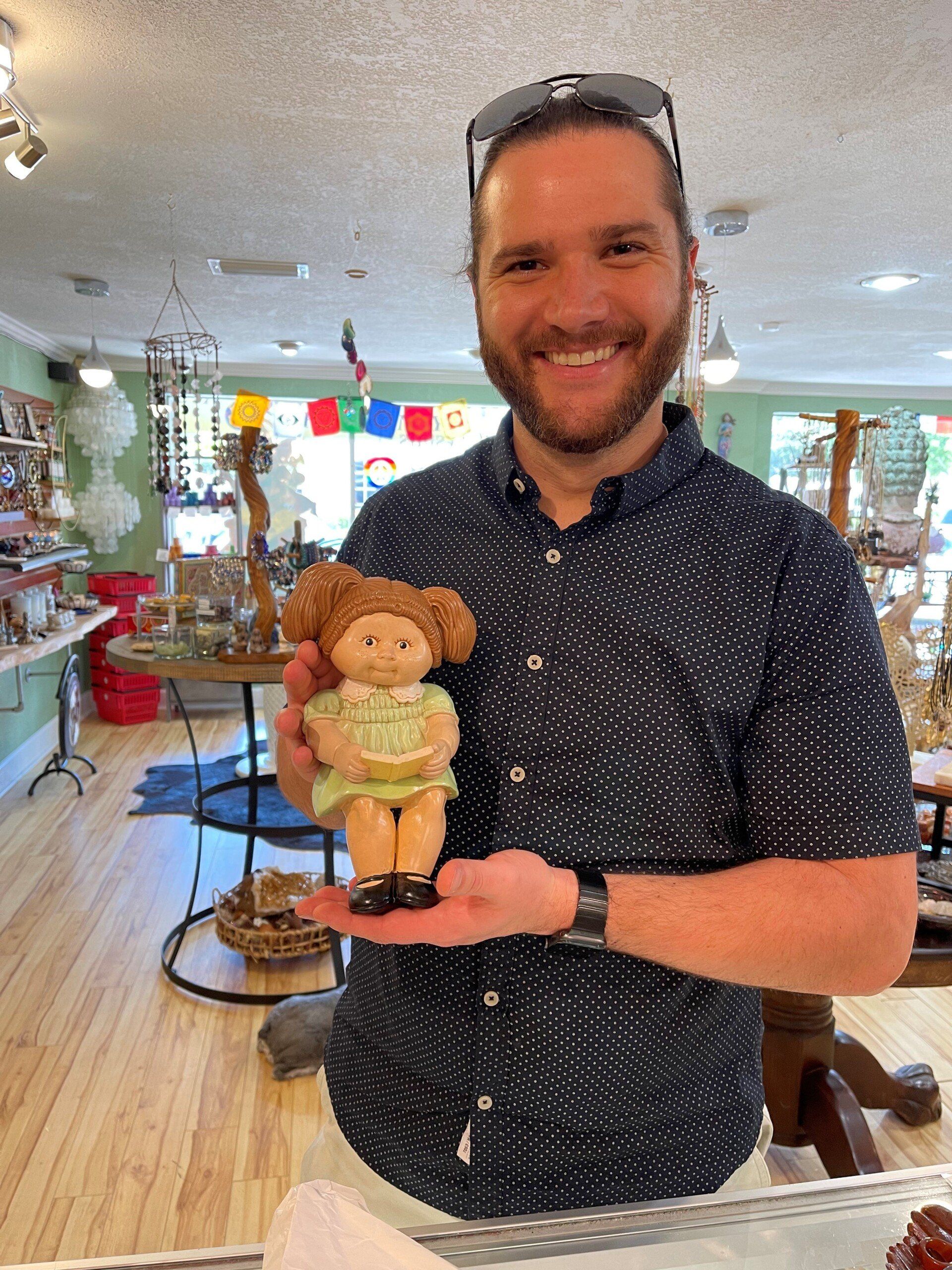 Close Up Photo of Man Holding A Doll — Tampa, FL — Antique Restoration and Design