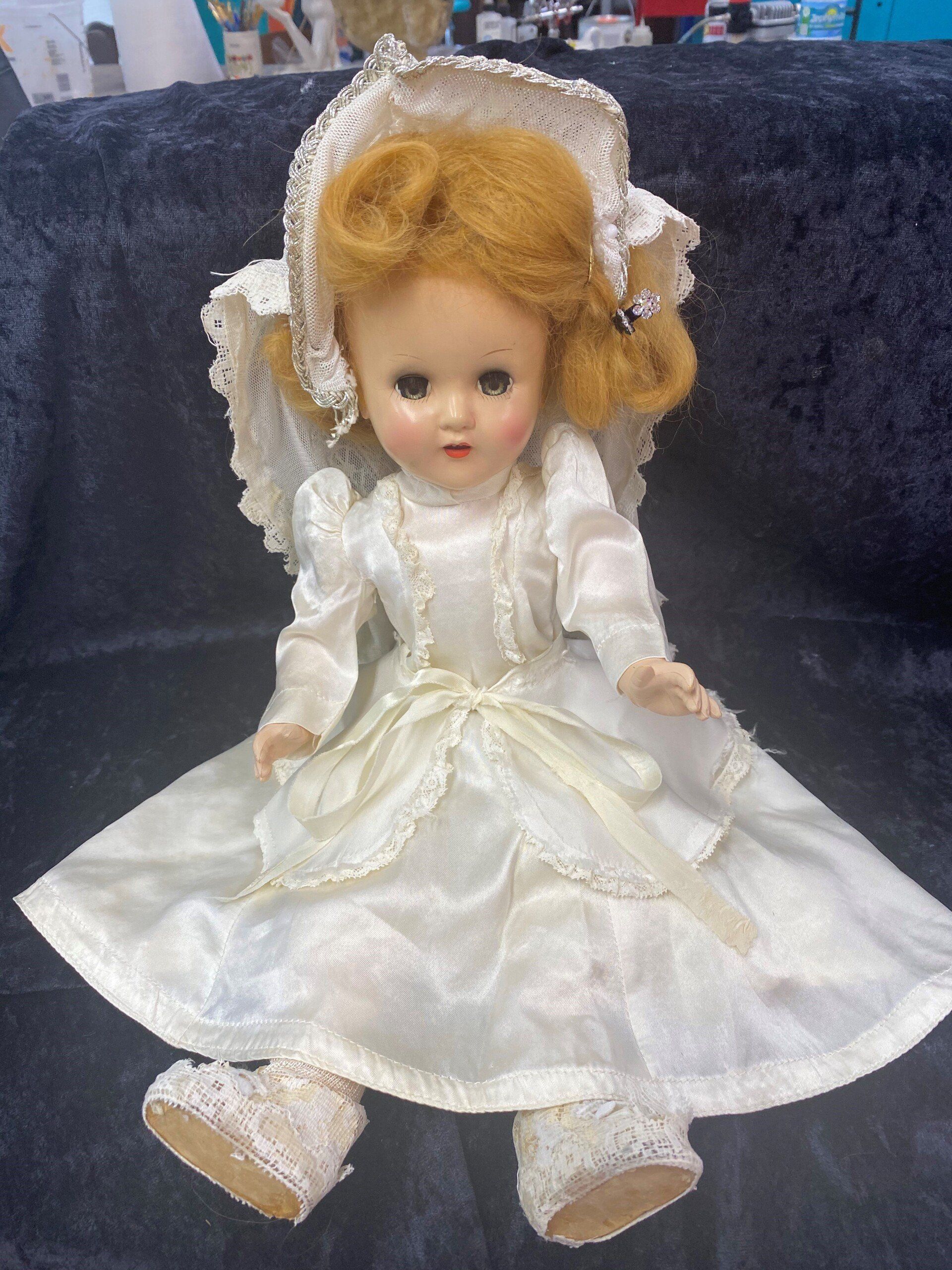 Doll Wearing A Wedding Dress — Tampa, FL — Antique Restoration and Design