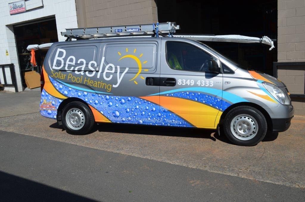 A beasley van is parked in front of a building