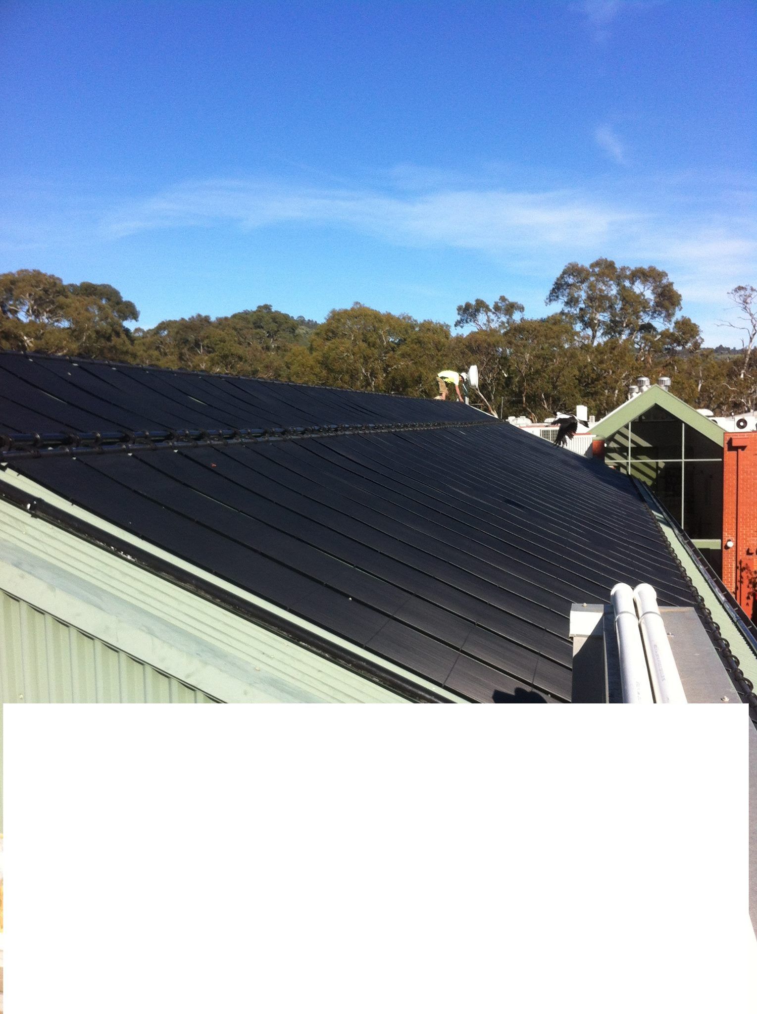 A roof with a lot of solar panels on it