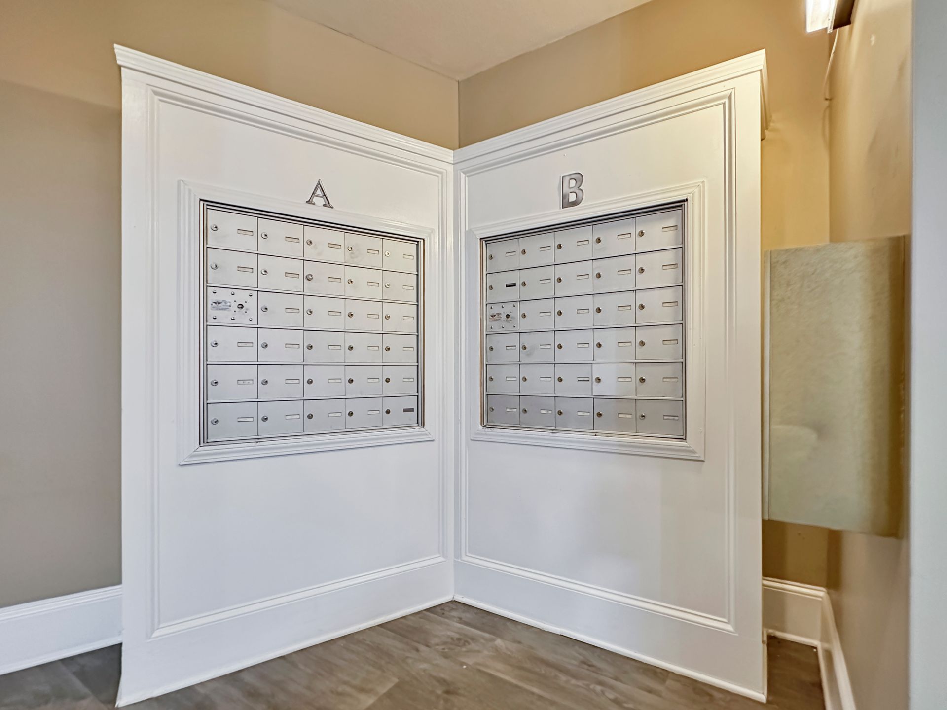 There are two mailboxes in the corner of the room.