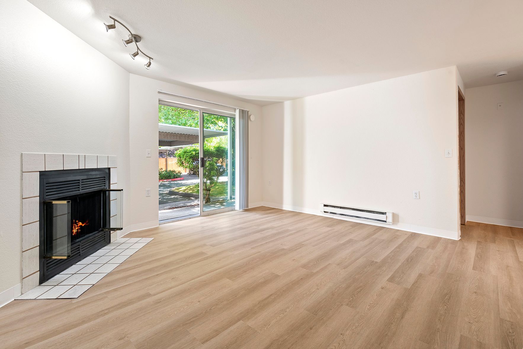 Living room with fireplace and patio