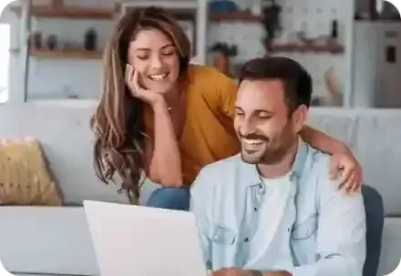 A couple receiving an air conditioning estimate with financing.