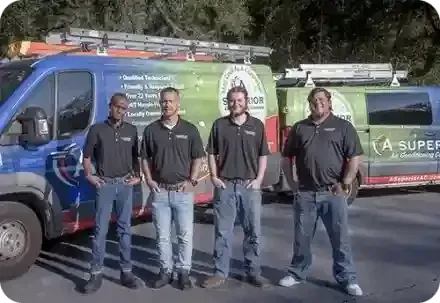 Four of A Superior AC's HVAC Installers standing together in their matching uniforms in Helen State Park FL.