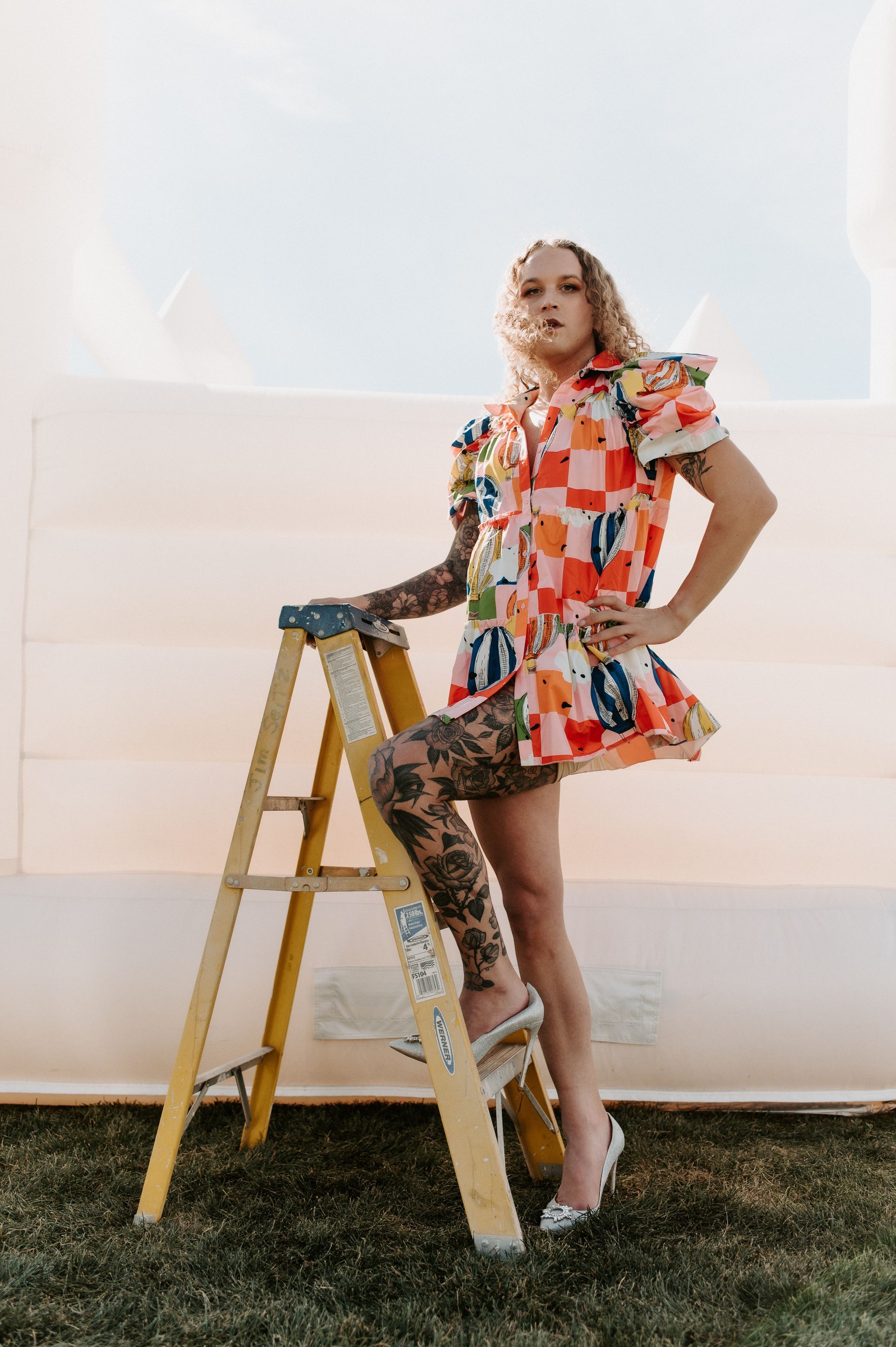 Scotty modeling on a ladder for a photoshoot