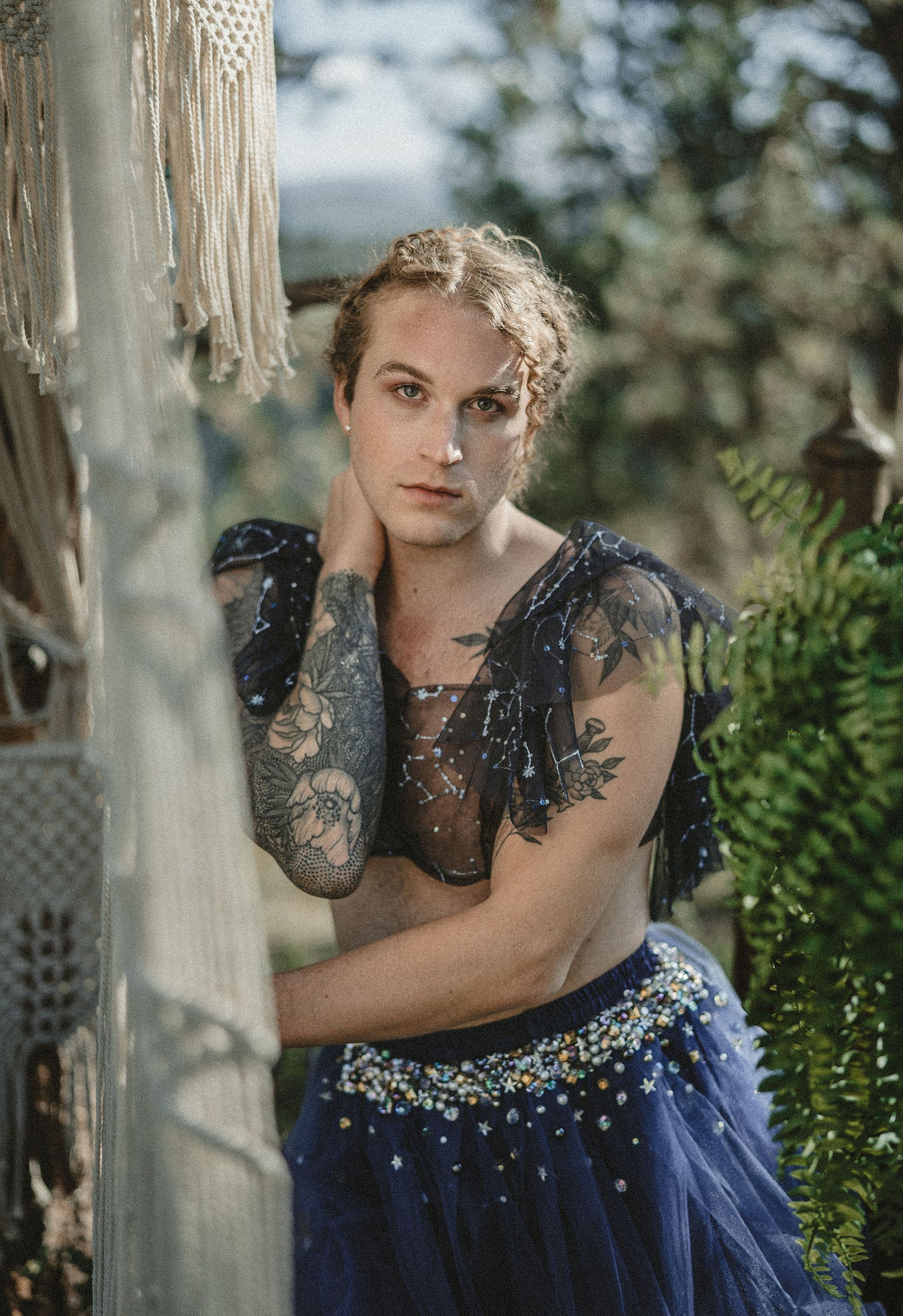 Scotty modeling outside in a tule blue dress for a photoshoot in the mountains 