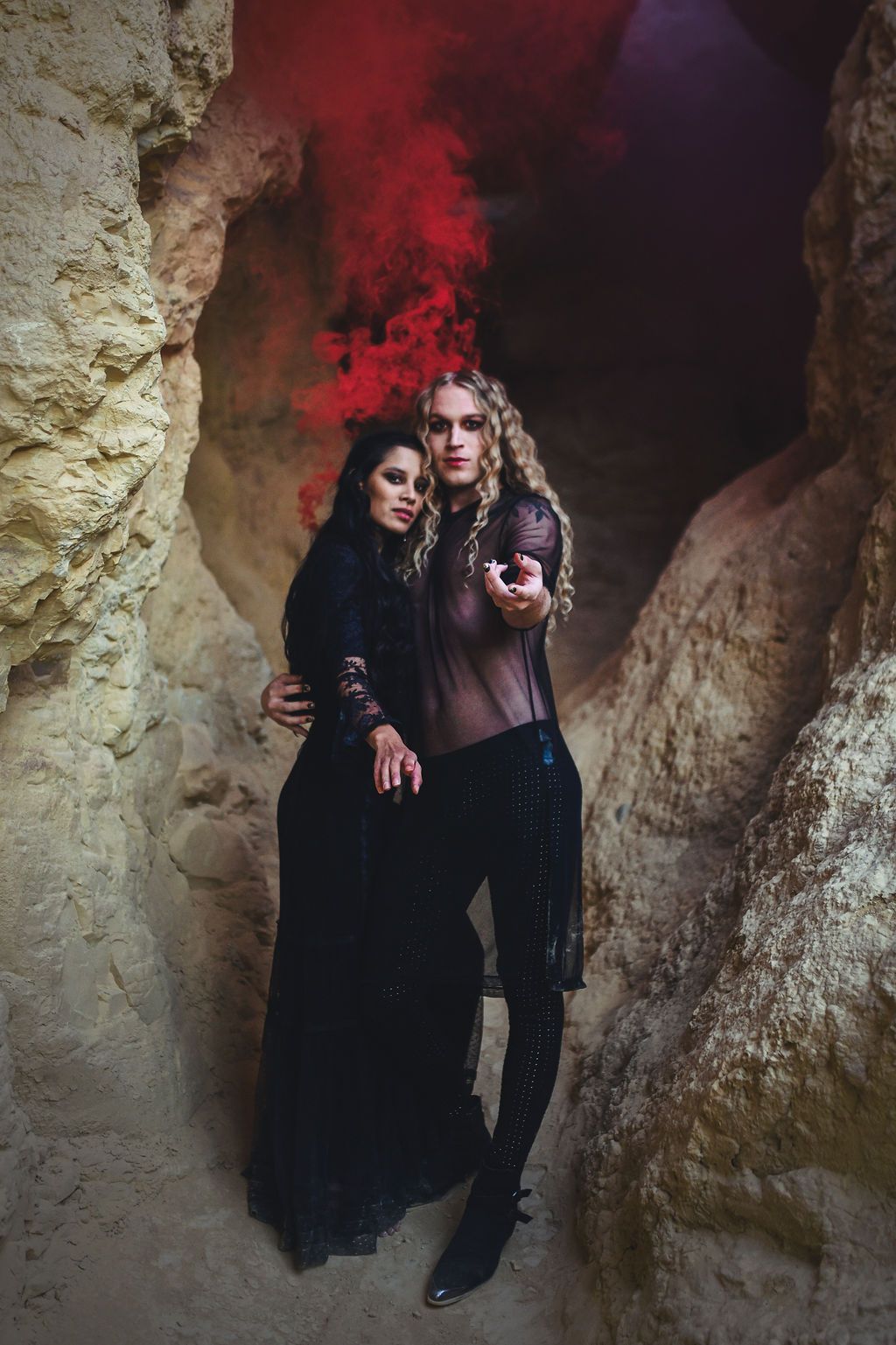 Scotty doing a model pose for a Halloween photoshoot in a cave