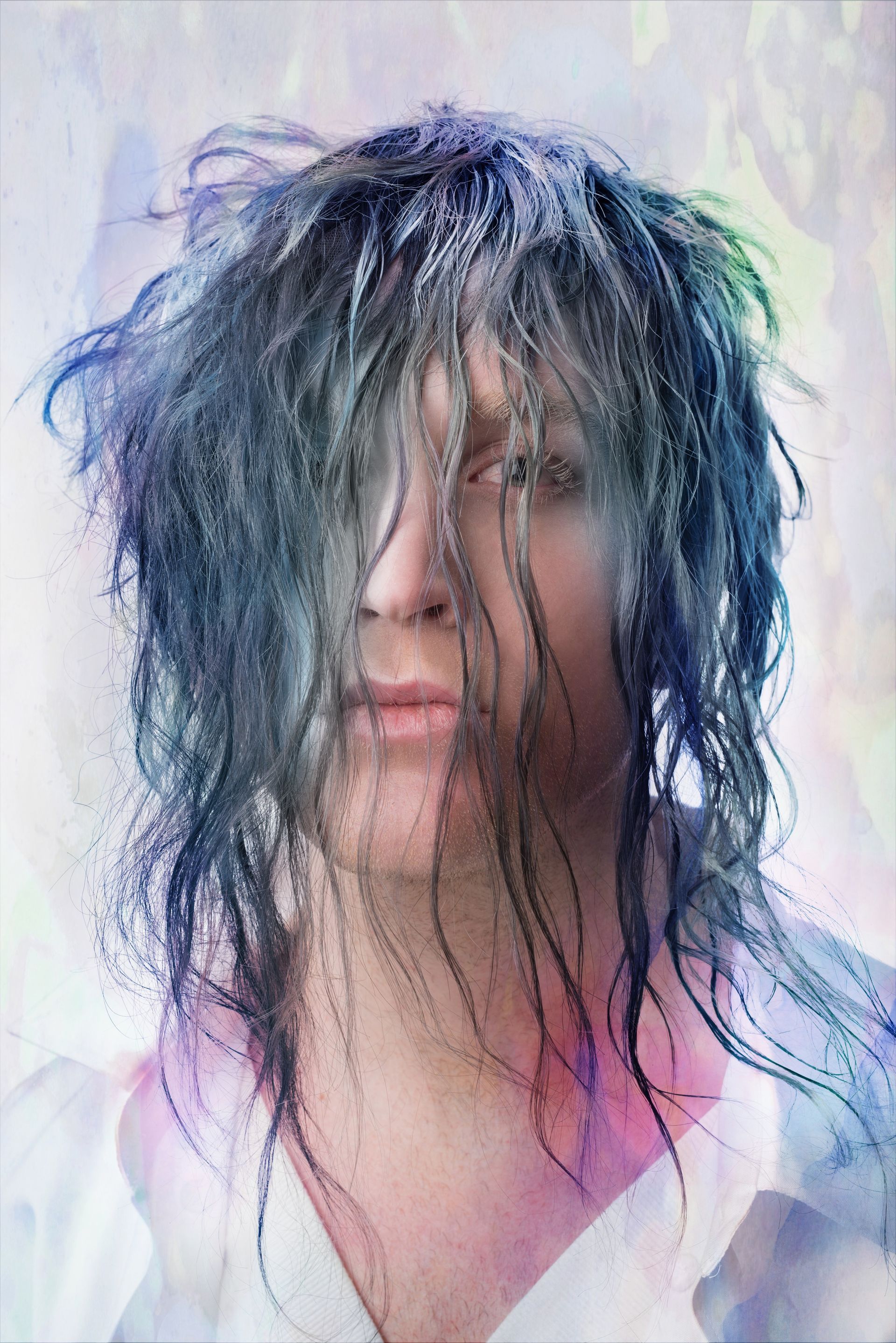 A close-up of a person's face with a wig on for a fashion magazine photo shoot.