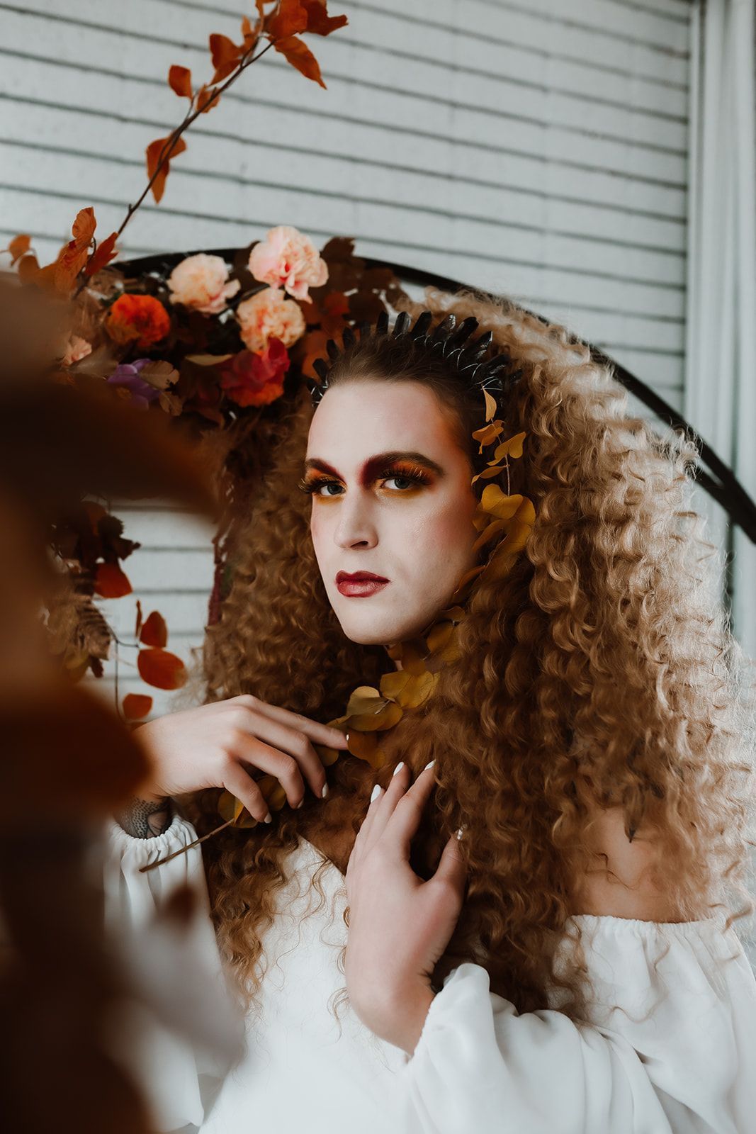 A professional photo of Scotty, modeling for a fall-themed goddess photoshoot