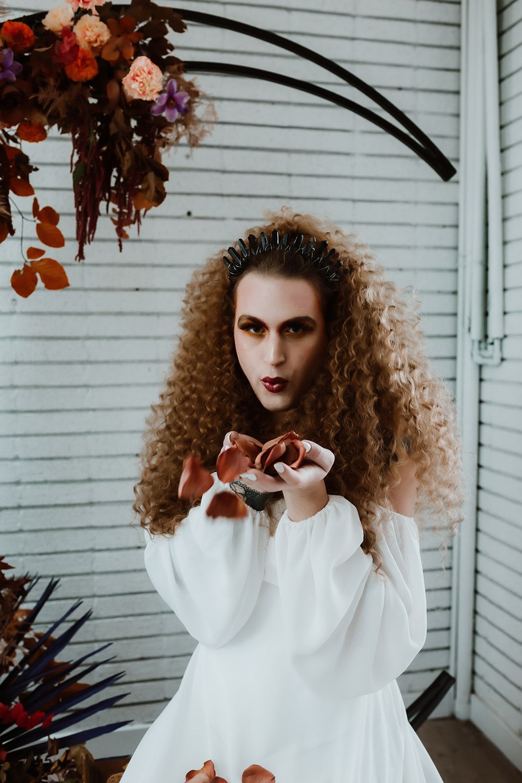 A professional photo of Scotty, modeling for a fall-themed goddess photoshoot