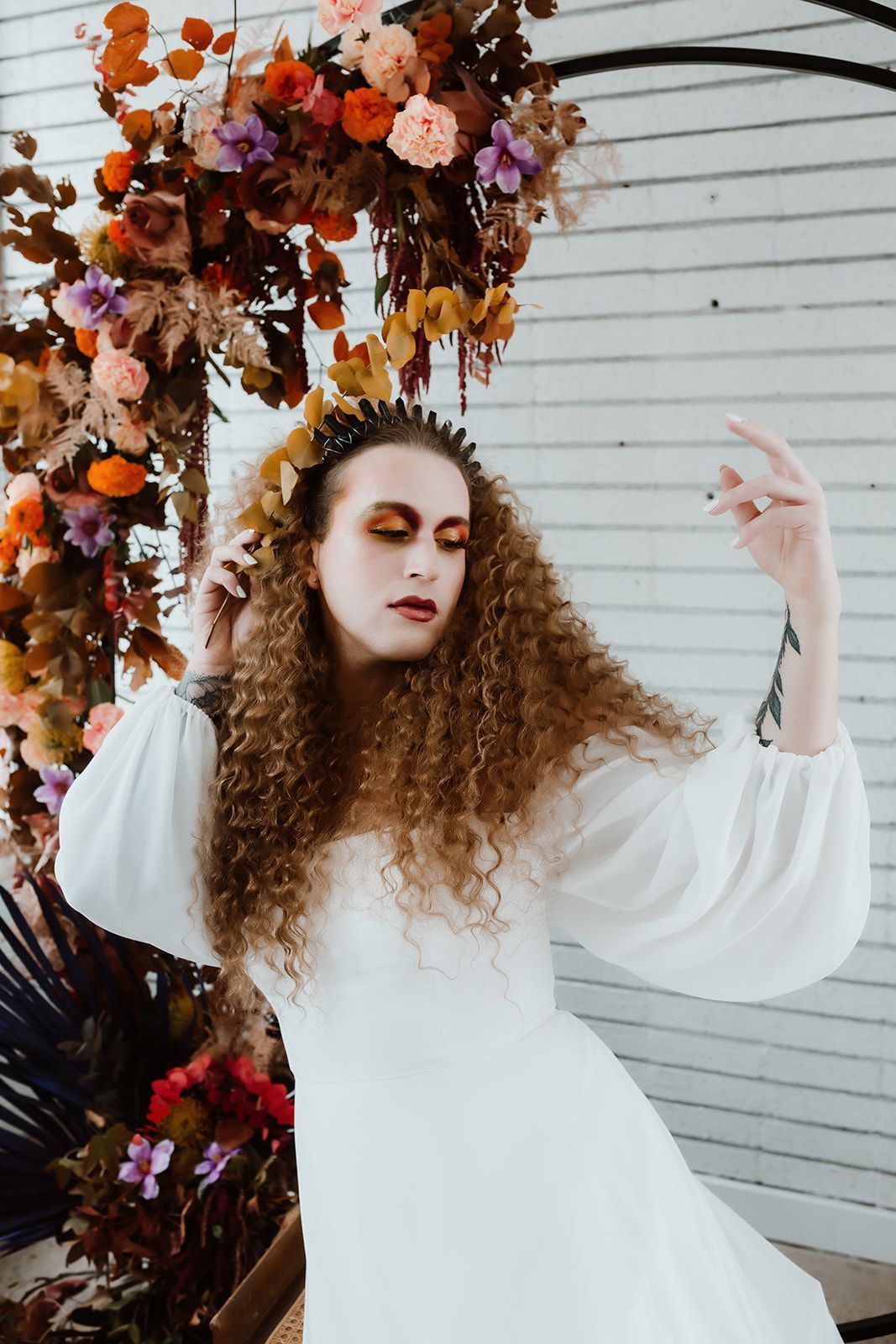 A professional photo of Scotty, modeling for a fall-themed goddess photoshoot