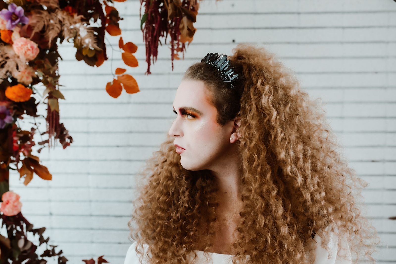 A professional photo of Scotty, modeling for a fall-themed goddess photoshoot