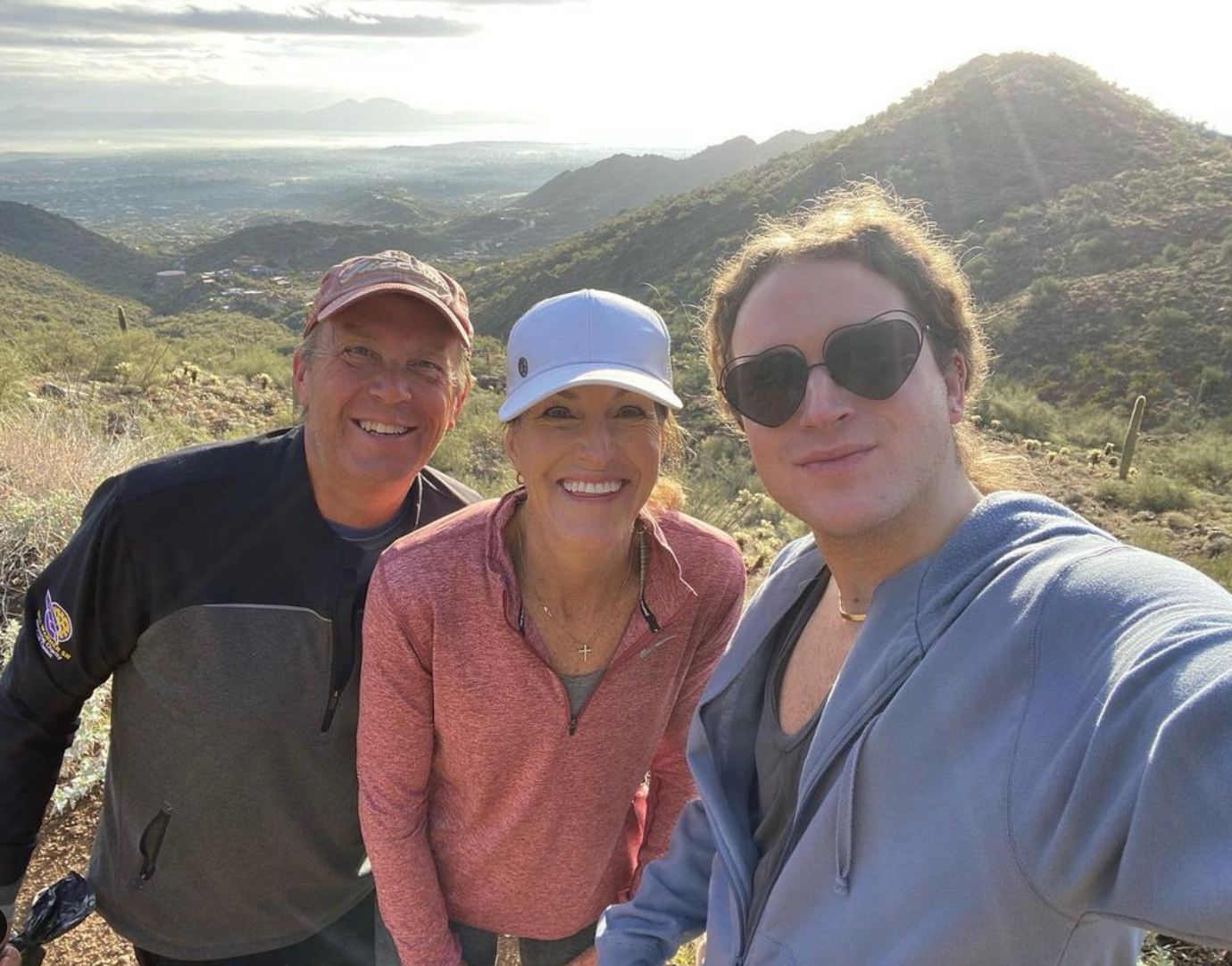 Scotty with his parents on a hike in the mountains