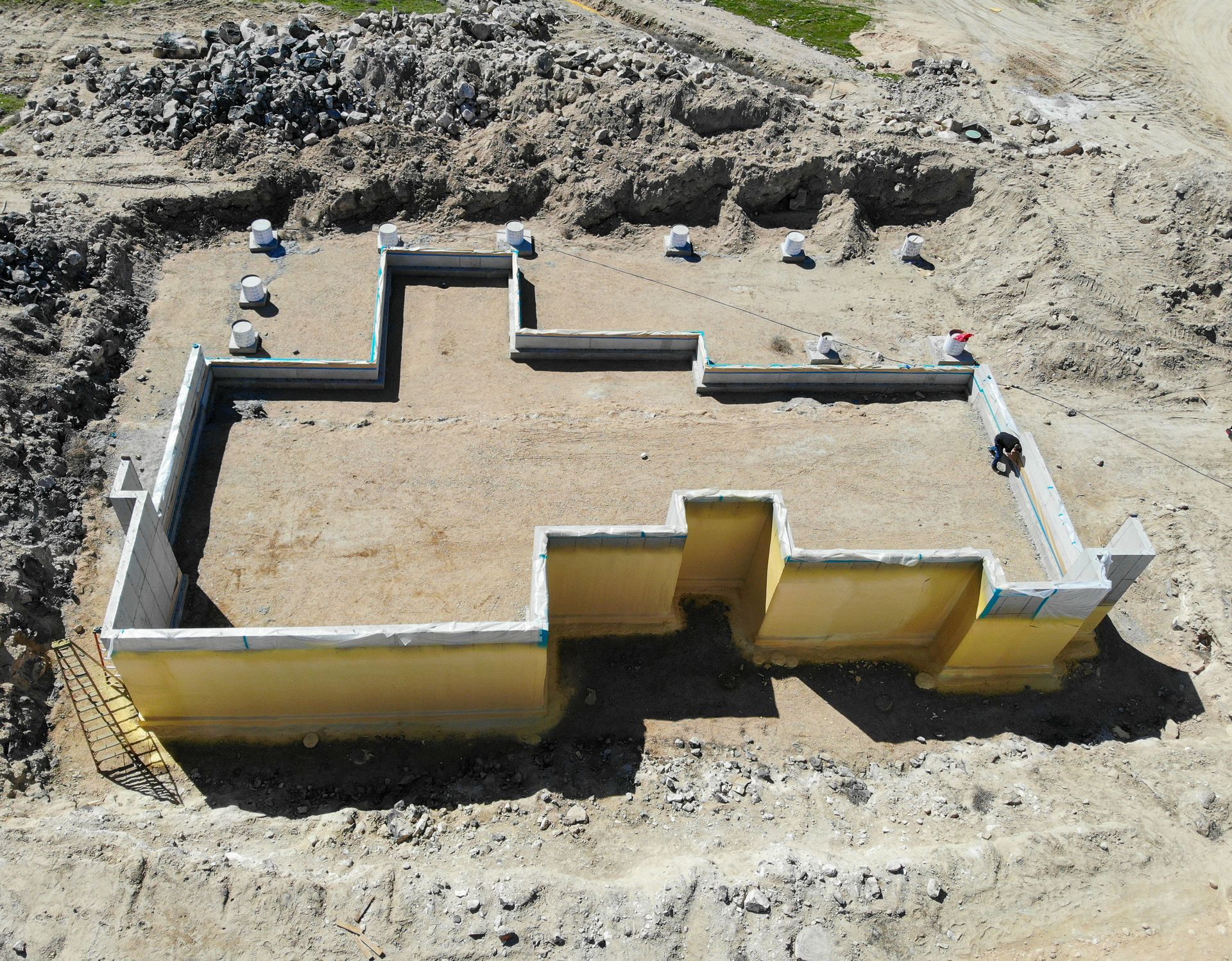 An aerial view of a house foundation under construction