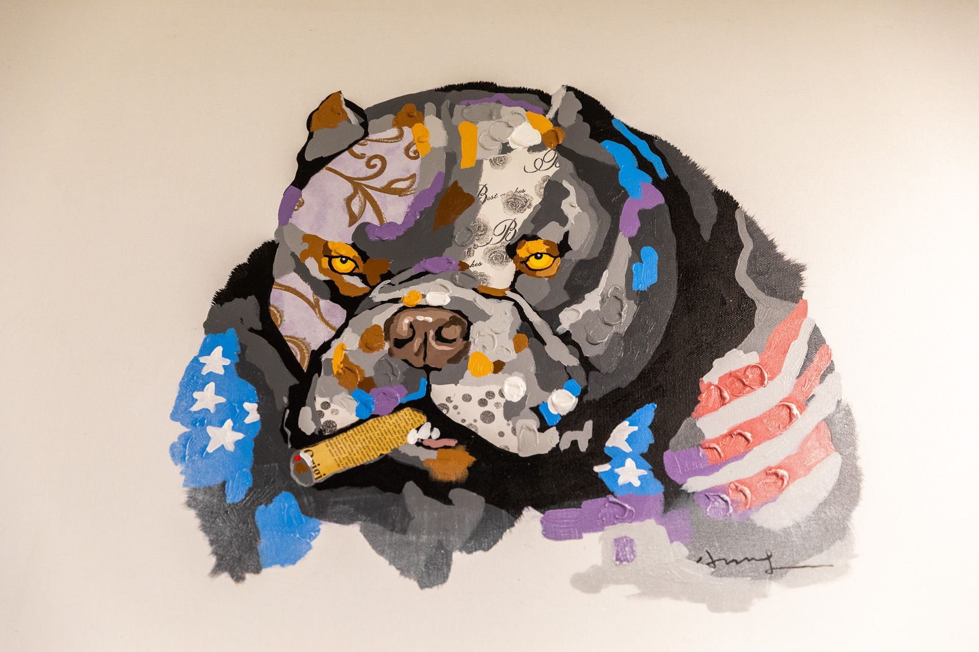 Stylized pit bull portrait with American flag accents, smoking cigar.