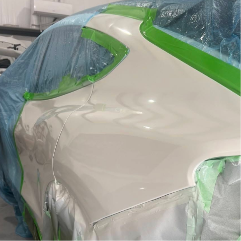 Car door repainted white, masked with green tape and blue plastic sheeting | Axe-A-Dent Auto Collision