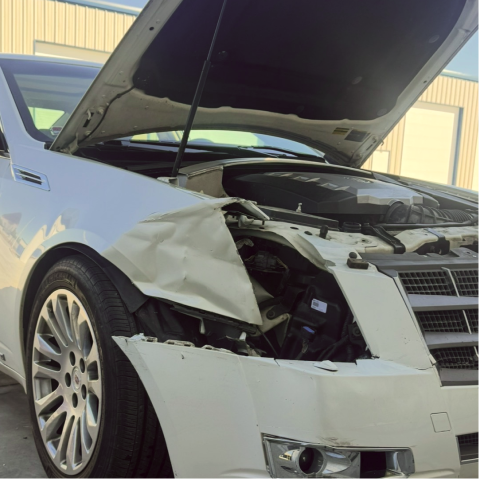 White car with front-end damage, hood open, parked in front of a building |
 Axe-A-Dent Auto Collision