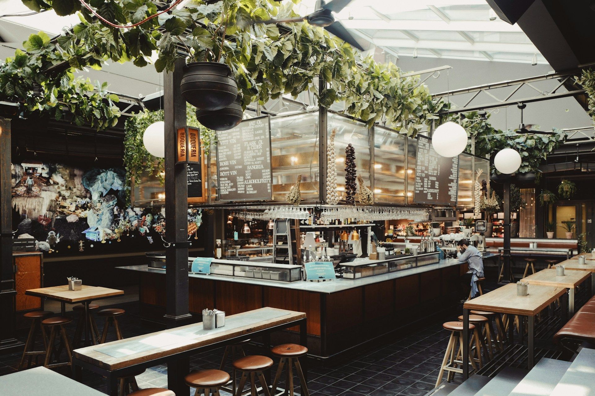 The bar interior of Boquerian in Stockholm featuring a large central serving counter