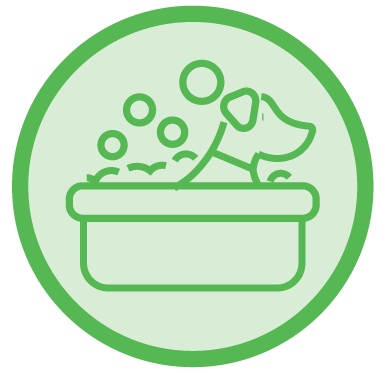 Green icon of a dog in a bathtub with bubbles.