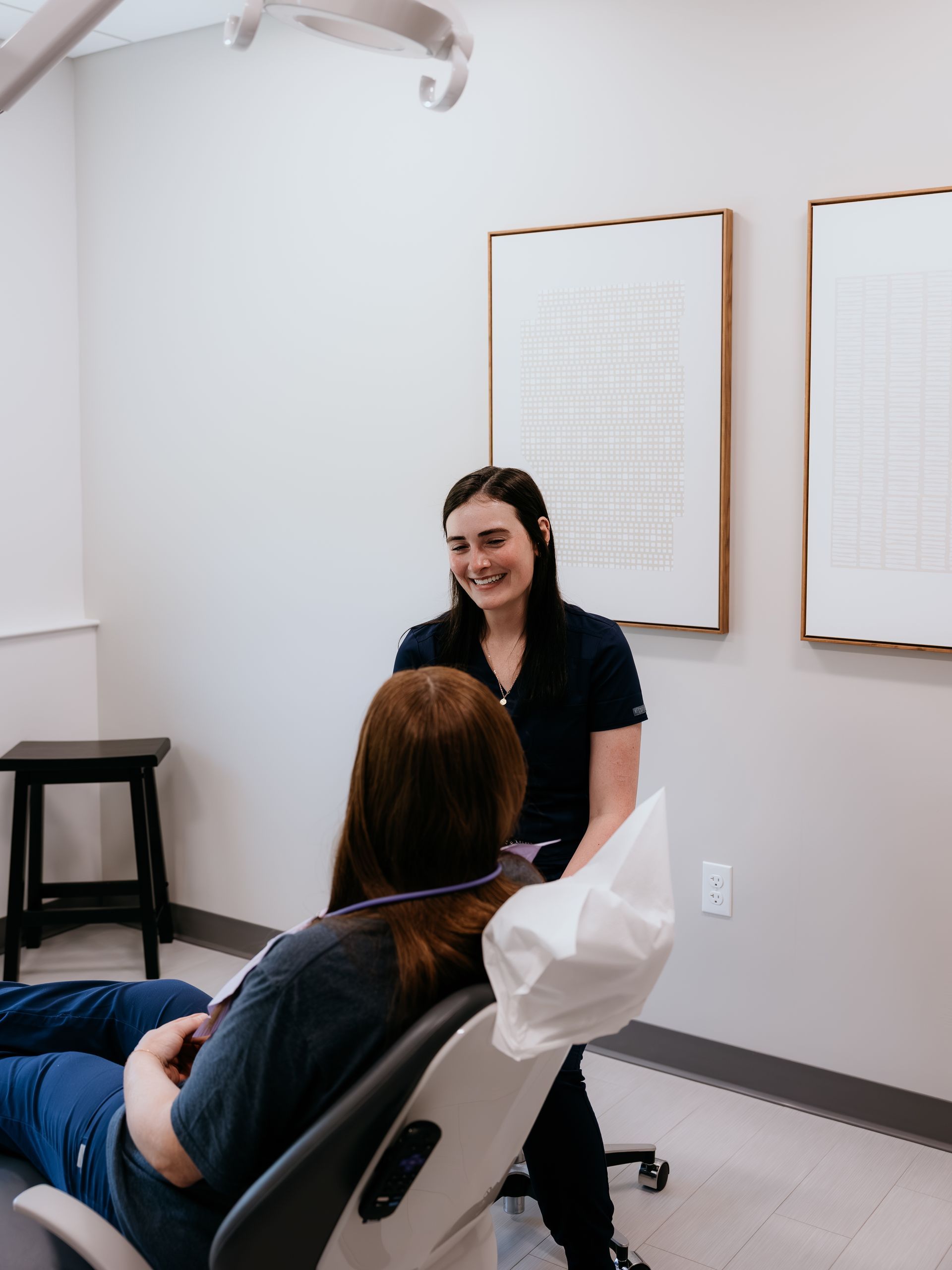 A man is holding a little girl in his arms.
