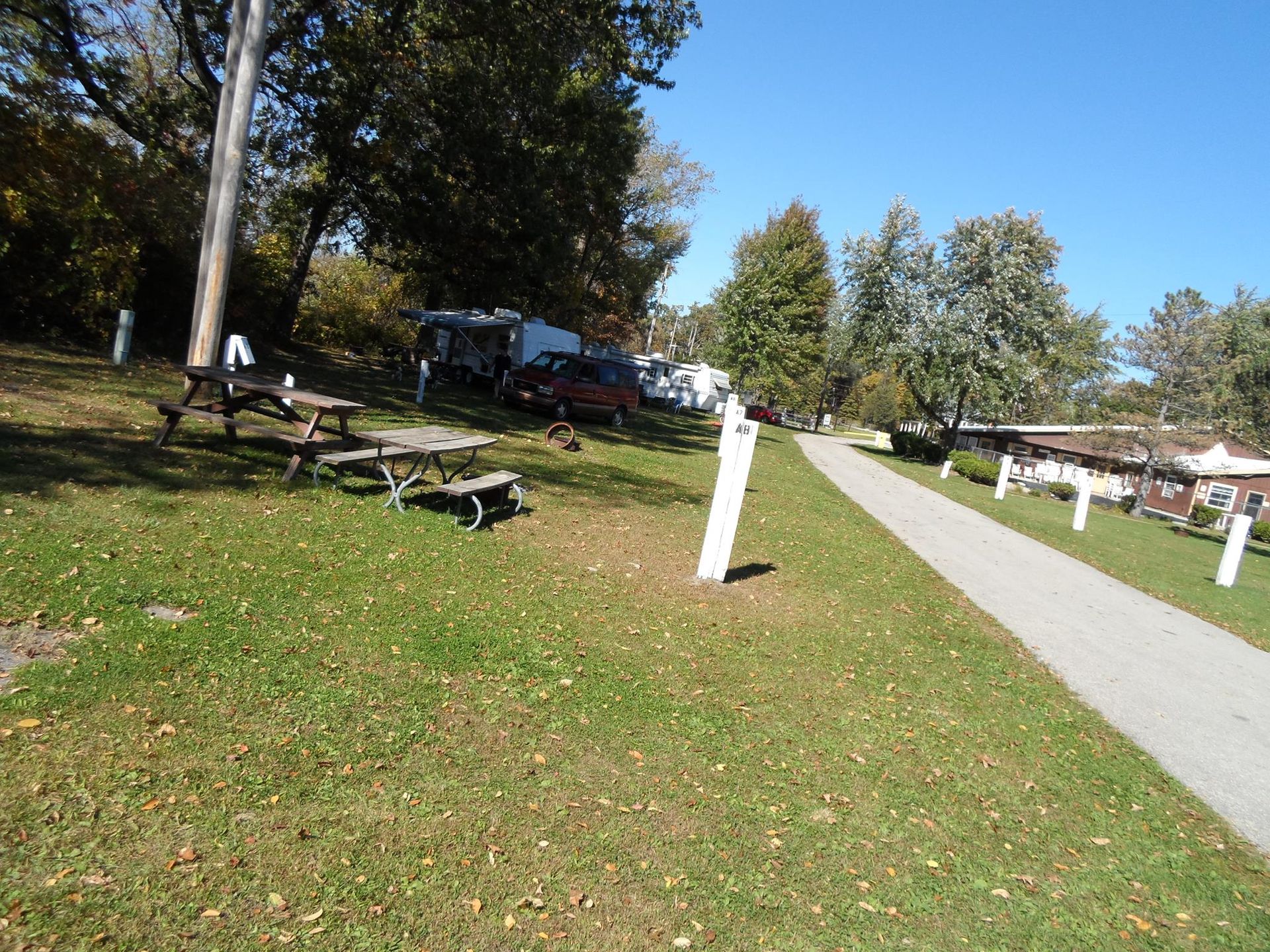 A park with picnic tables and a path going through it