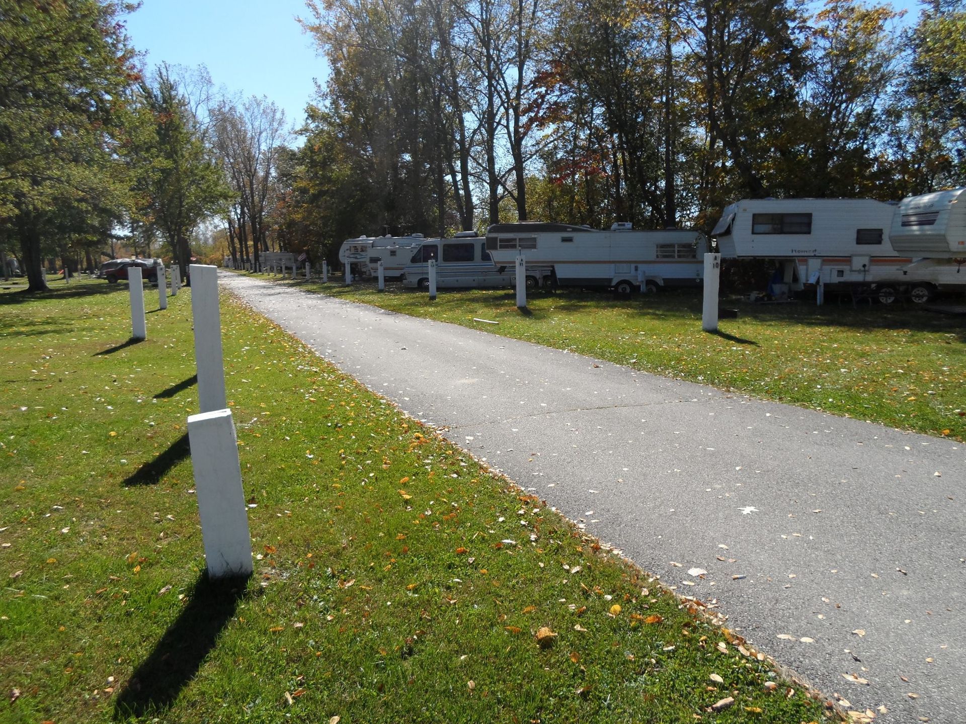 A row of rvs parked on the side of a road