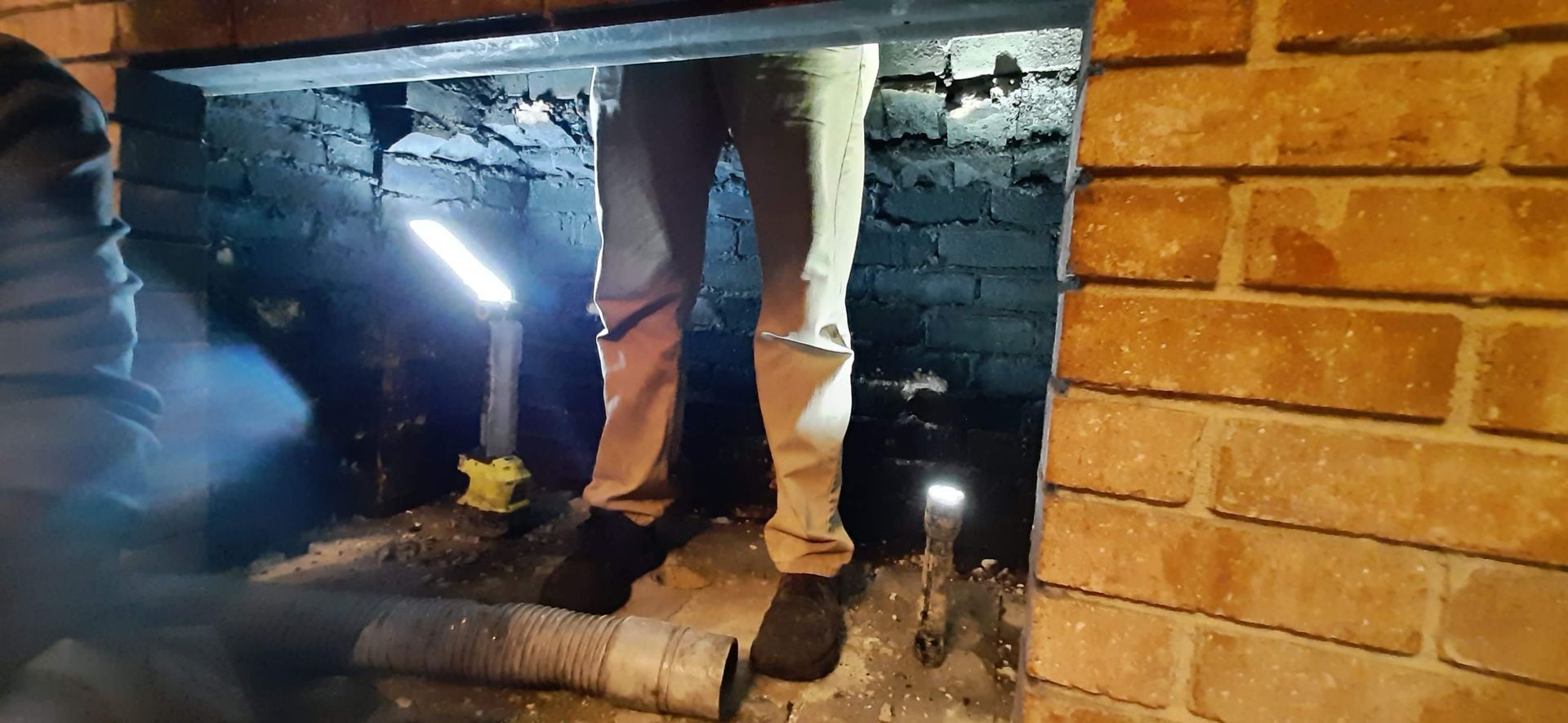 Top Hat Chimney Sweeps rebuilding a fireplace and chimney.