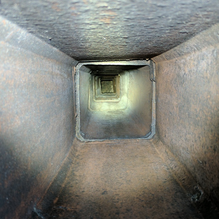 a tunnel with a light coming out of the end of it .