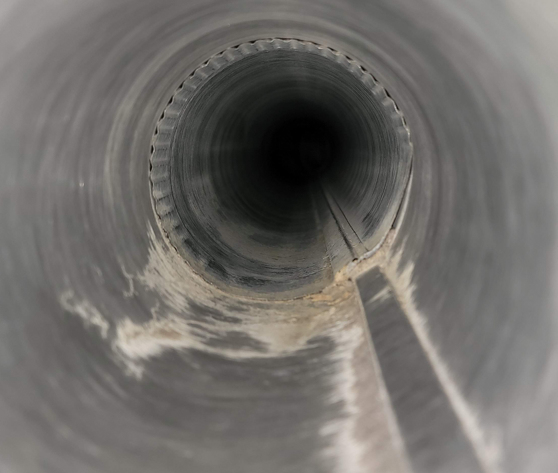 a close up of the inside of a metal pipe