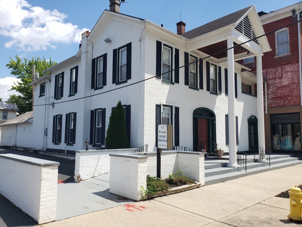 Several photos of interior and exterior view of Brough Funeral Home in Miamisburg, OH