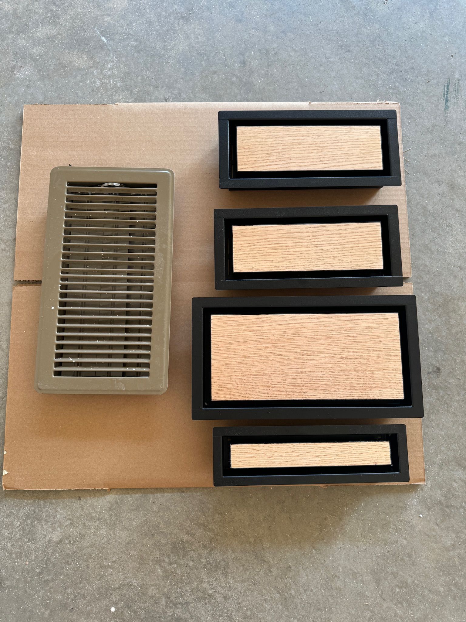 A cardboard box with a few pieces of wood on it