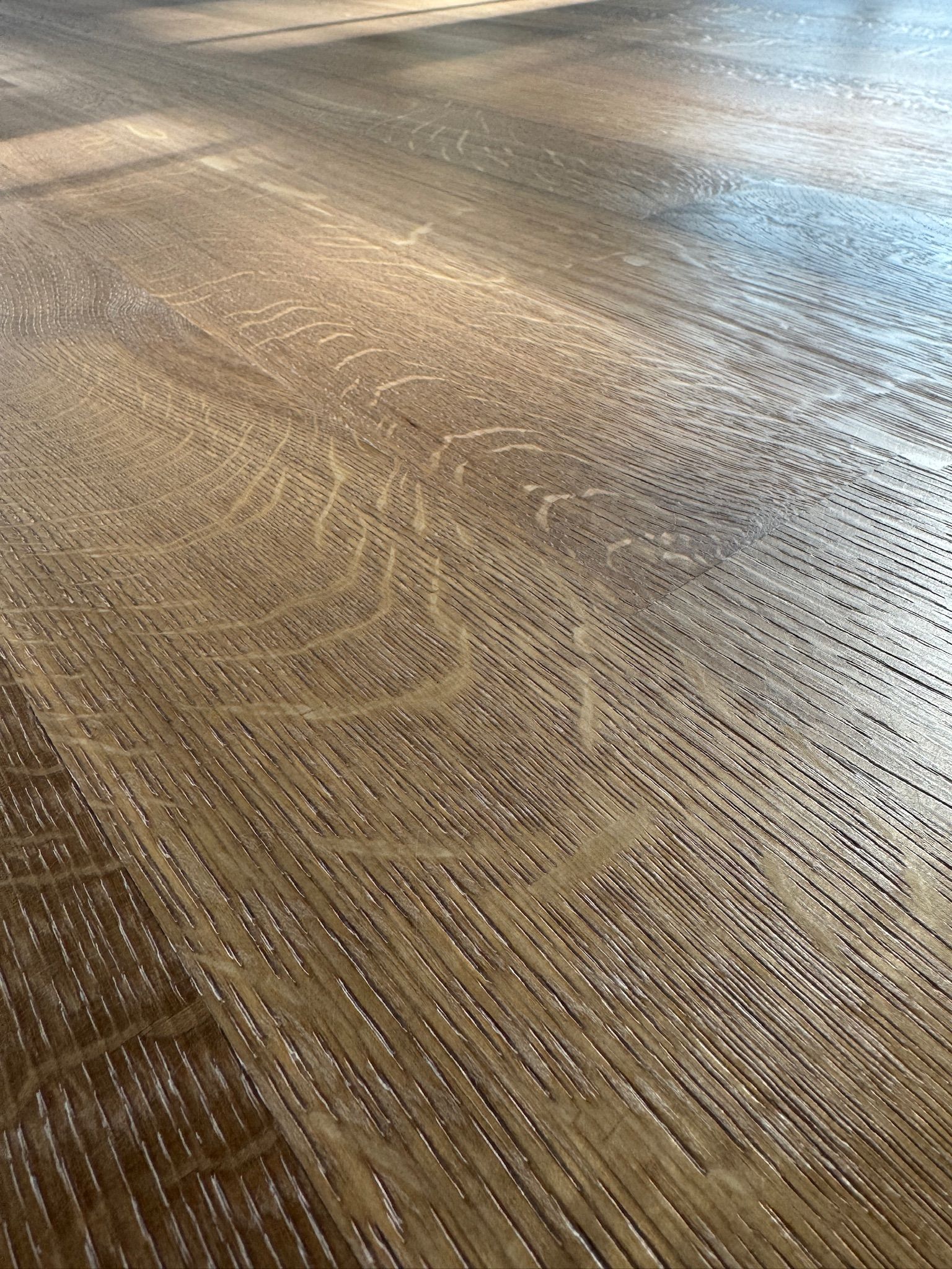 A close up of a wooden floor with a lot of grain.